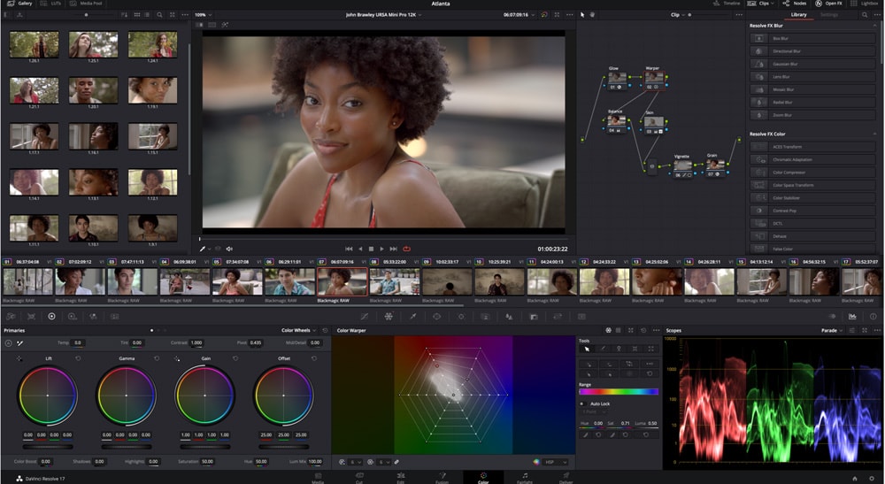 Professional video editor at a color grading and editing workstation